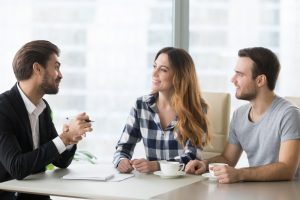 lawyer, insurer or salesman consulting happy millennial couple making offer